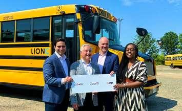 London North Centre MP Peter Fragiskatos, Senior Director of the Canada Infrastructure Bank Brian Reilly, Langs Bus Lines Vice-President Kevin Langs, and London West MP Arielle Kayabaga, June 21, 2024. Photo from @pfragiskatos on X.
