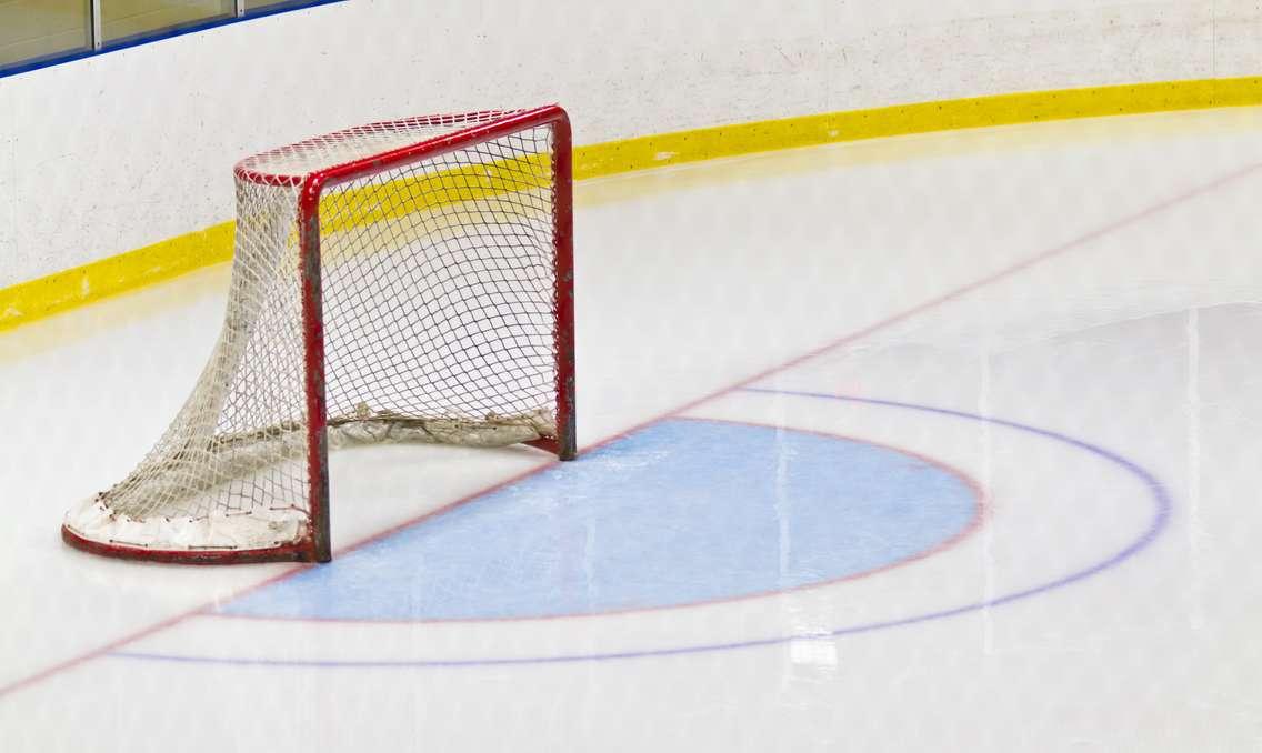 A hockey net on a rink. © Can Stock Photo / ClickImages