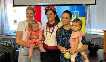 Ukrainian refugee Olena Volodina (middle) alongside a few of her Ukrainian friends. 18 July 2023. (Photo by Sarnia News Today)
