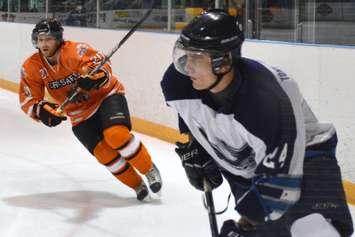 Saugeen Shores defenceman Trevor Smith (right) is chased by Shallow Lake forward Adam Blundell.