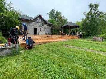 GECDSB construction students get hands on experience while repairing a deck at the John Freeman Walls Historic Site, June 5, 2025. (Photo by Maureen Revait) 