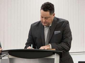 Lakeshore Ward 2 Councillor Michael Hoffman signs his declaration of office after being named to the vacant seat on October 1, 2024. Photo courtesy Municipality of Lakeshore.