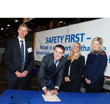 David Harris (left), President and CEO of Kinectrics, looks on while James Scongack, Bruce Power’s Executive Vice President, Corporate Affairs & Operational Services, signs a Memorandum of Understanding between the companies to collaborate in the production of medical isotopes.  Looking on is Kinga Surma, MPP for Etobicoke Centre, and Christine Hogarth, MPP for Etobicoke-Lakeshore. (photo submitted by Bruce Power) 