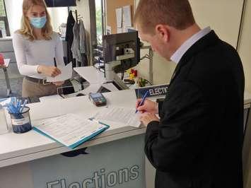 London Deputy Mayor Josh Morgan signs his nomination papers to run for mayor. May 26th, 2022. (Craig Needles, Blackburn Media)