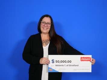 Melanie Thompson celebrating her $50,000 lottery win.