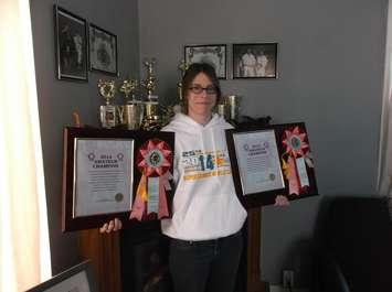 Promar Karate Sensei Becky Schweitzer poses with her World Titles (Submitted Photo)