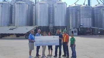 Ian Montgomery & Mark Foxton representing the WDH Foundation with Lily Ferreira, Andrea Cordes, Troy Snobelen, 
Marvin Cook and Shannon Bieman representing Snobelen Farms. (Photo Contributed)