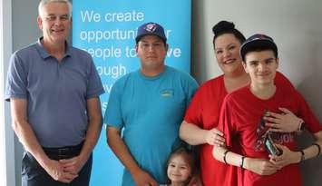 Pictured in the photo are Habitat for Humanity Grey Bruce Executive Director Greg Fryer (left), as well as Don, Angie, and their children. Photo from Habitat for Humanity Grey Bruce.