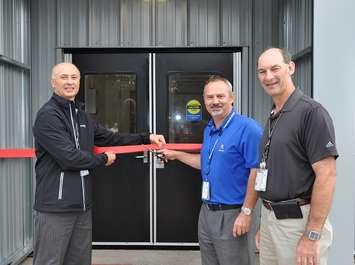 Mike Rencheck (left) Bruce Power President and Chief Executive Officer, is joined by Jeff Phelps, Vice President, Major Projects, and Ian Kennedy, Vice President, Site Services, in cutting the ribbon at the grand re-opening of the Centre for Project Excellence. (photo submitted)