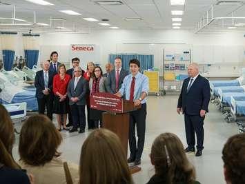 Prime Minister Justin Trudeau announces federal funding for Ontario health care, as Premier Doug Ford, right, and others listen, in King City, Ontario, February 9, 2024. Photo courtesy Prime Minister Justin Trudeau/X.