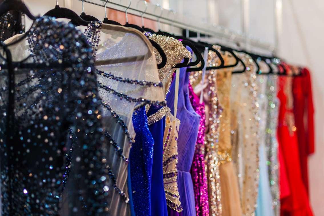 Prom dresses on a rack (Photo by Silk-stocking/iStock/Getty Images Plus via Getty Images)