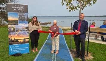  Sarawak Park Ribbon Cutting - Deputy CAO Brittany Drury, Mayor Sue Carleton, CAO Niall Lobley at Mobi-mat and Tree Planting. Photo from Georgian Bluffs. 