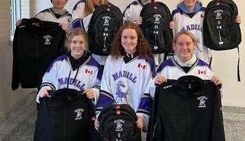 Some members of the F.E. Madill Girls Hockey Team.  Back Sadie Pennington, Kailyn Armstrong, Aubrey Anne Cameron, Chloe Seabrook Front Annan Moffat, Alexis Greig, Lacey Heibein. Photo from Ean Moffat