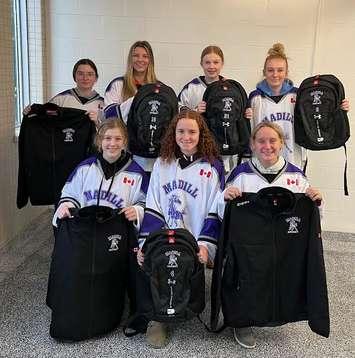 Some members of the F.E. Madill Girls Hockey Team.  Back Sadie Pennington, Kailyn Armstrong, Aubrey Anne Cameron, Chloe Seabrook Front Annan Moffat, Alexis Greig, Lacey Heibein. Photo from Ean Moffat