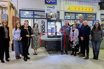 St. Michael Catholic Secondary School in Stratford celebrated the arrival of a new CNC industrial milling machine and five desktop training units. From Left to right: Mary Helen Van Loon, Chair of the Huron-Perth Catholic DSB; Michelle Henning, Vice President of Answer Precision Technologies Inc. and CTMA Rep.; Tonya  Sabatos, Rapid Gear; Dave Lewis, Past Chair, Ontario Council for Technology Education (OCTE); Carolyn Bell, Principal, St. Michael CSS; Mark Flanagan, OYAP Lead, Huron-Perth CDSB; Karen Tigani, Director of Education, Huron-Perth CDSB; Dean Tretowsky, Deputy Warden of Perth County; Matthew Rae, MPP, Perth-Wellington; Mayor Martin Ritsma, City of Stratford; and Gaby Parejo, Huron Manufacturers Association.