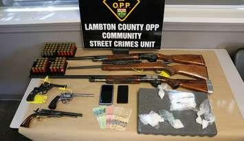 Drugs, guns and cash seized by the OPP in busts in St. Clair Township and Wallaceburg - Oct. 12/24 (Photo courtesy of OPP)