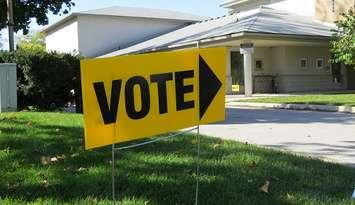 A sign outside of a polling station. (File photo by Miranda Chant, Blackburn News)