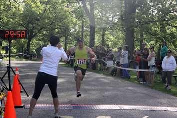 Matthew Fecht of Warren Mich. wins the 2014 YMCA-CHOK Bridge Race in 30:04.5 (Photo By Dave Dentinger)