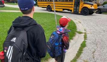 Students get on school bus. September 2022. (Blackburn Media file photo)