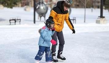 A father and child skate on the outdoor rink in Victoria Park. File photo courtesy of the City of London. 