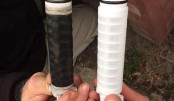 Filters before (right) and after (left) Dover well water runs through them. March 09, 2017.  (Photo by Paul Pedro)
