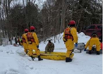 First responders engage in a rescue of two people from a tractor in rising water near the Maitland River in Central Huron, March 6, 2025. Photo provided by Ontario Provincial Police.