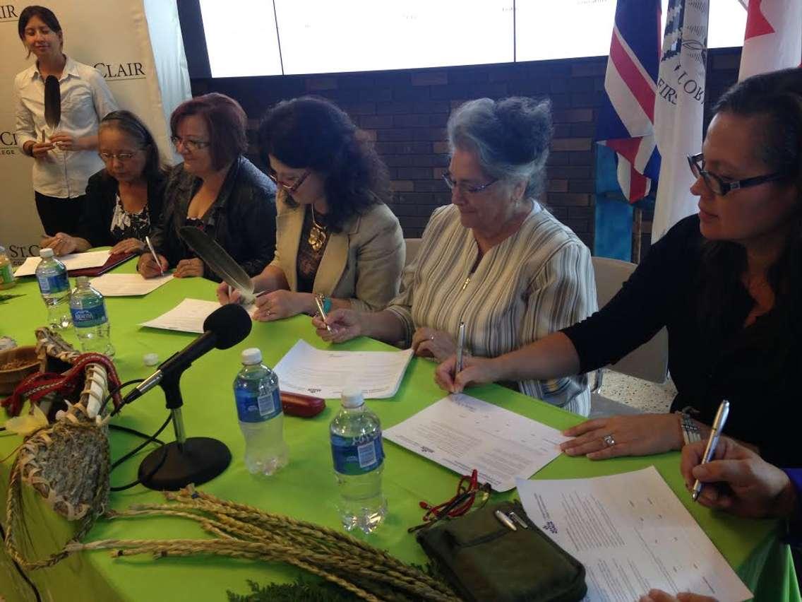 St.Clair College president Patti France and Aboriginal leaders sign the Indigenous Education Protocol, September 22, 2015. (Photo by Adelle Loiselle)