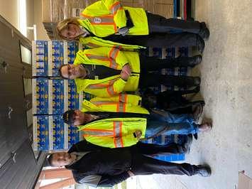 The team at Fairmount Security donates a skid of much needed Kraft Dinner to the Owen Sound Food Bank. (Photo by Logan Strauss)