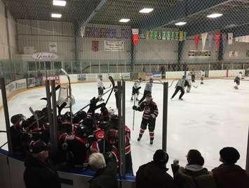 Walkerton celebrates Brett Coulson's OT winner in Game 1 of the Western Jr. C Final in Wingham.  Photo by Marty Thompson.