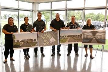 Artist's renderings are displayed for a proposed pickleball complex at Essex Centre Sports Complex, August 28, 2024. Seen are, from left, Councillor Katie McGuire-Blaise, Mayor Sherry Bondy, PickleBarn Program Manager Evan Hollinsky, Councillor Brad Allard, PickleBarn General Manager Scott Hollinsky, and Councillor Kim Verbeek.