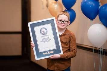 Jace Weber shows off his official Guinness World Record Certificate. Photo by Candice Weber