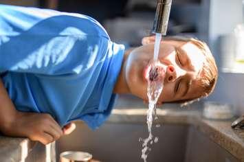 Child drinking water.  Credit Getty Images.  LSOphoto