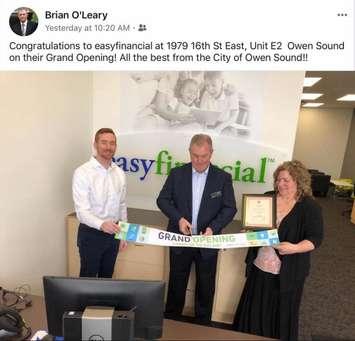 Owen Sound Deputy Mayor Brian O'Leary (centre) helps cut the ribbon to open EasyFinancial's new Owen Sound office (Photo from Facebook)