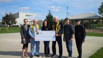 left to right:  Karen Ott,  Lions Club President Charles Bodle, Angela Smith, Lions Secretary Clayton Groves, Steve Ott, Sam Ott (Photo by Bob Montgomery)