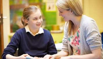 Reading buddies.  Photo from GettyImages. Credit: Monkeybusinessimages