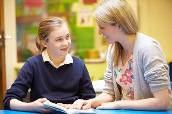 Reading buddies.  Photo from GettyImages. Credit: Monkeybusinessimages