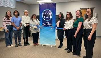 Deputy Mayor Diane Huber and Davina Wong cut ribbon at grand opening.    Left to right: Lindsay Haggle (Medical Secretary), Aman Sohrab (Nurse Practitioner), Jill Roote (Manager, Strategic Initiatives, Town of Saugeen Shores), Deputy Mayor Diane Huber, Davina Wong (Associate Vice President, Home and Community Care, VON), Colleen  Fowler (Nurse Practitioner), Elizabeth Clare (Nurse Practitioner), Karlee Sweiger (Nurse Practitioner). Photo from Saugeen Shores 