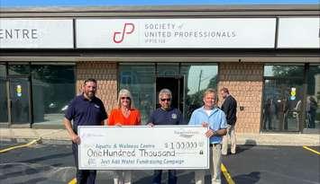 From left to right: Luke Charbonneau, Mayor of Saugeen Shores, Michelle Johnston, SUP President, Rob Stanley, AWC Fundraising Coordinator, and, Dave Ceksters, SUP Bruce Power Local Vice President. Photo from Saugeen Shores