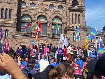Demonstrators gather in front of the Legislative Assembly of Ontario on September 25.