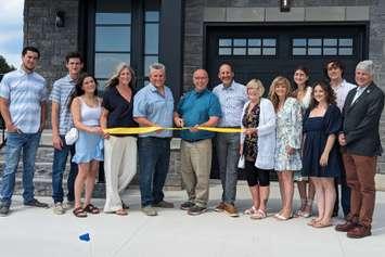  A ribbon cutting at the Seashore development in Kincardine with members of the Orsi and Beisel families joined by representatives from the municipality, county, and province. Photo from the Municipality of Kincardine.