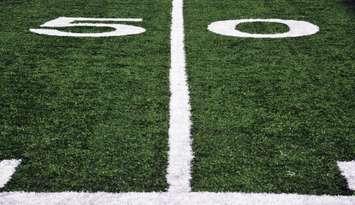 Football 50-yard-line  (© Can Stock Photo / purple_dragon)