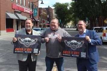 John Fairley (left), Andrew Thiel (middle), and CK Mayor Darrin Canniff (right) pose for a photo promoting Crowfest 2024. (Photo by Matt Weverink)