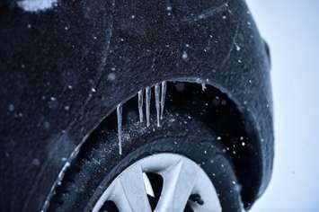 Car covered in ice during freezing rain. (roibu / iStock Getty Images Plus)