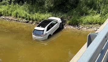 A vehicle crashed into a ravine off Perth Line 20, July 15, 2025. Photo provided by Perth OPP.