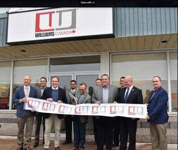 Kelly Powers, President, Power at Williams Industrial Services Group (WISG), cuts the ribbon to officially open the company’s new offices in Port Elgin. Powers is surrounded by representatives of WISG, the Town of Saugeen Shores, and from Bruce Power, President and CEO Mike Rencheck (left), and Eric Chassard, Executive Vice-President, Projects and Engineering (second from left).