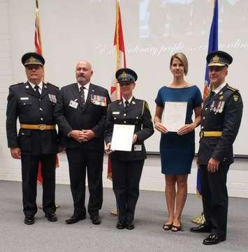 photo from left; OPP West Region Commander John Cain, Mr. Don Denne from St. John Ambulance, Provincial Constable Kerry-Lynn Hall, Paisley Fire Fighter Lauren Messer, and OPP Commissioner Thomas Carrique.