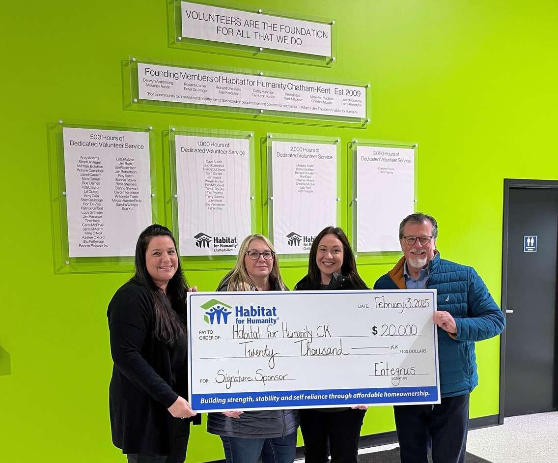 Cheque presentation. Anne Taylor, Director of Partnerships and Stakeholder Relations, Habitat for Humanity Chatham-Kent; Amy Adams, Entegrus & Habitat Board Member; Sarah Regnier-Pittman, Entegrus; and Jim Hogan, President & CEO, Entegrus (Image courtesy of Entegrus)