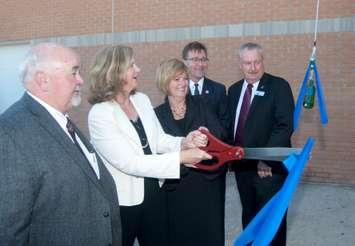 Dignitaries cut a ribbon which launched a champagne bottle to christen the new Algoma Central Corporation Marine Emergency Duties (MED) Centre at the Owen Sound Campus of Georgian College on Thursday, Oct. 6. Participants are, from left, Eric McKenzie, Vice President, Technical Services, Lower Lakes Towing; MaryLynn West-Moynes, President and CEO, Georgian College; Karen Watt, Vice President Human Resources, Algoma Central Corporation; Bill Walker, Bruce-Grey-Owen Sound MPP; and Alan Barfoot, Grey County Warden. (Submitted photo)