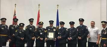 - Huron OPP officers & Goderich Fire Department Firefighters receive awards from Chief Superintendent John Cain (far left) and OPP Commissioner Thomas Carrique (far right).