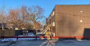 Firefighters used a ladder to rescue tenants trapped on the second floor during a fire at the apartment building on Trafalgar Street at Rectory Street, March 21, 2024. Photo provided by the London Fire Department.